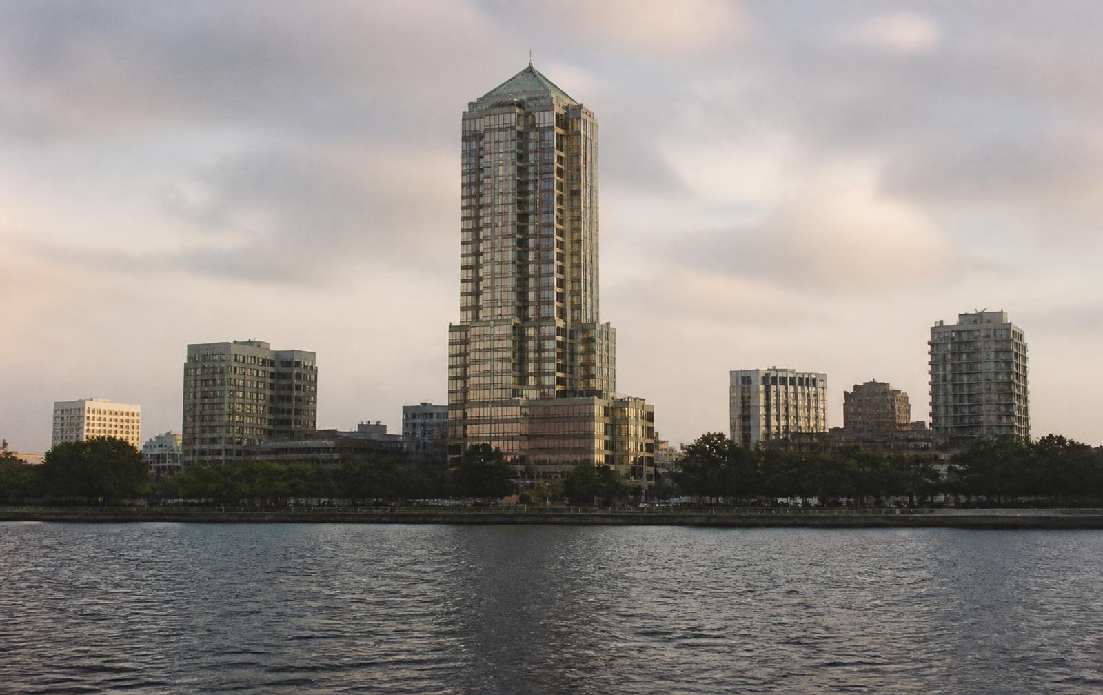 Downtown Jacksonville office towers seen across the St. Johns River at dusk.